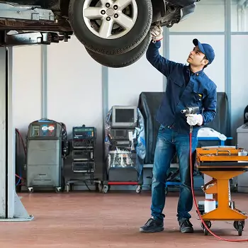 Mechanic Repairing Transmission